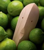 A wooden object sitting in the middle of limes.