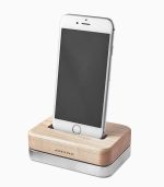 A phone is sitting on the wooden stand