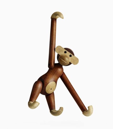 A wooden monkey hanging from the ceiling